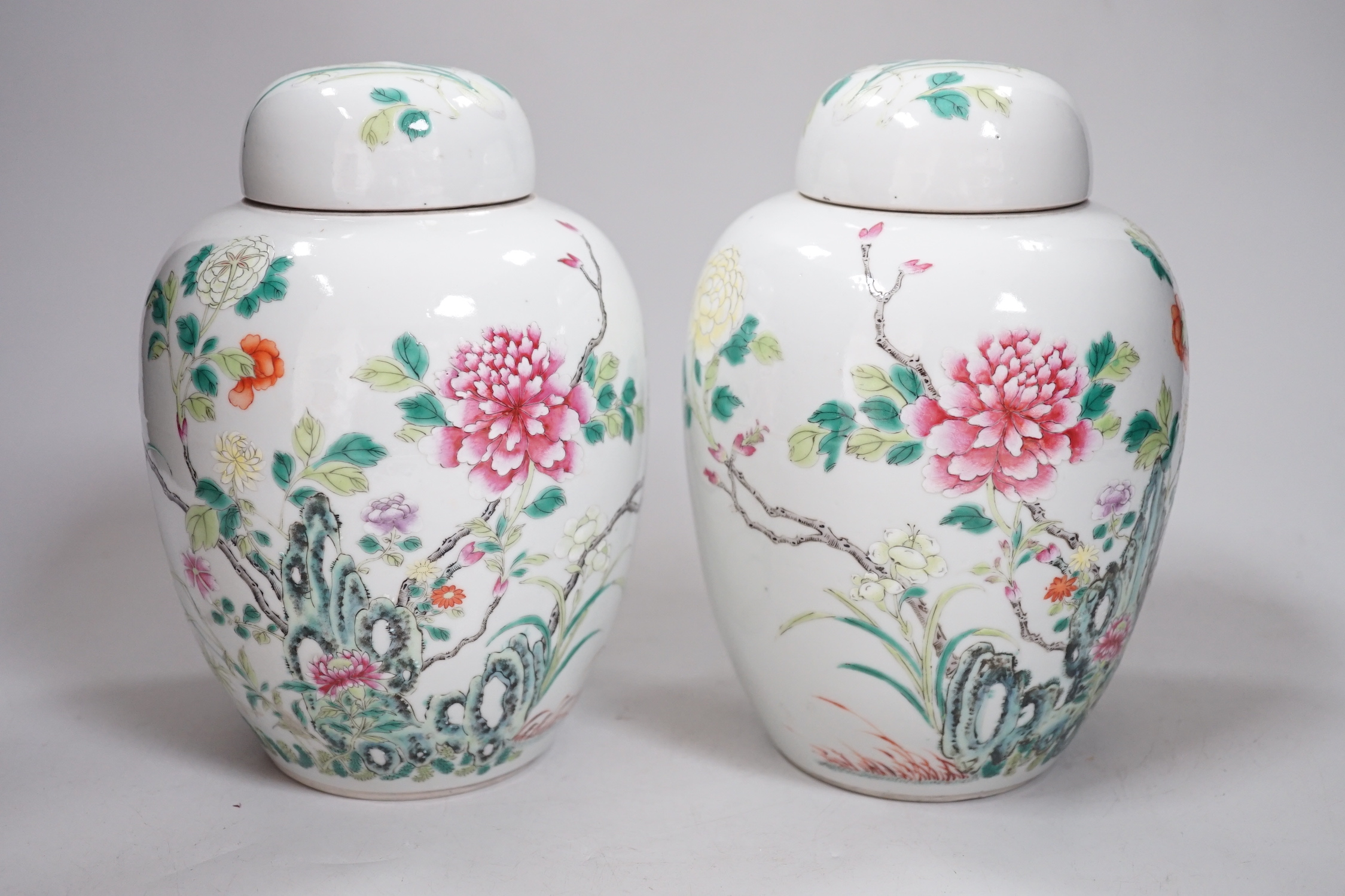 A pair of Chinese famille rose jars and covers, Qianlong seal marks, late 19th century, 20cm high